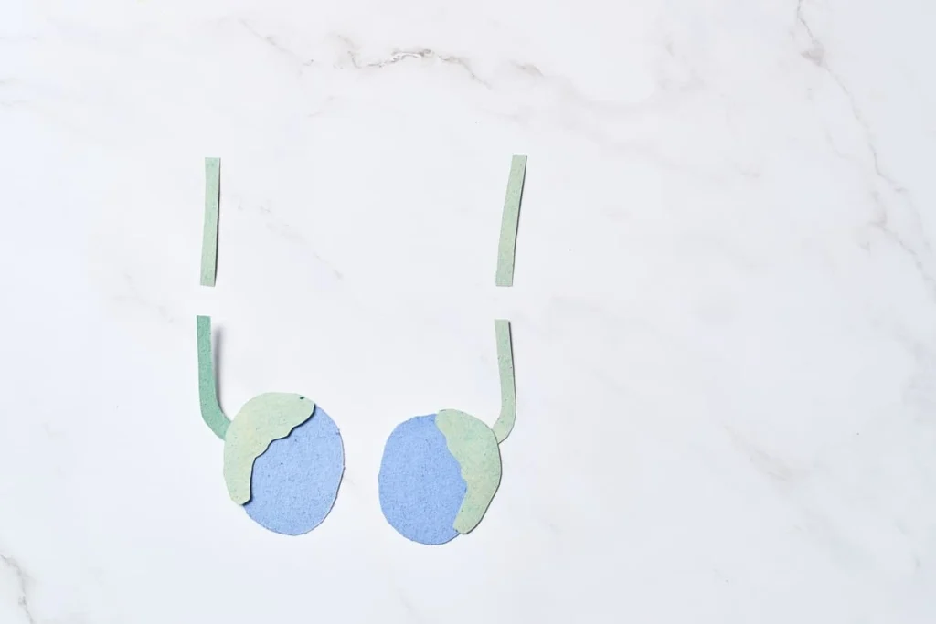 Ilustração de dois testículos com canais cortados representando vasectomia e o contexto da reversão de vasectomia.